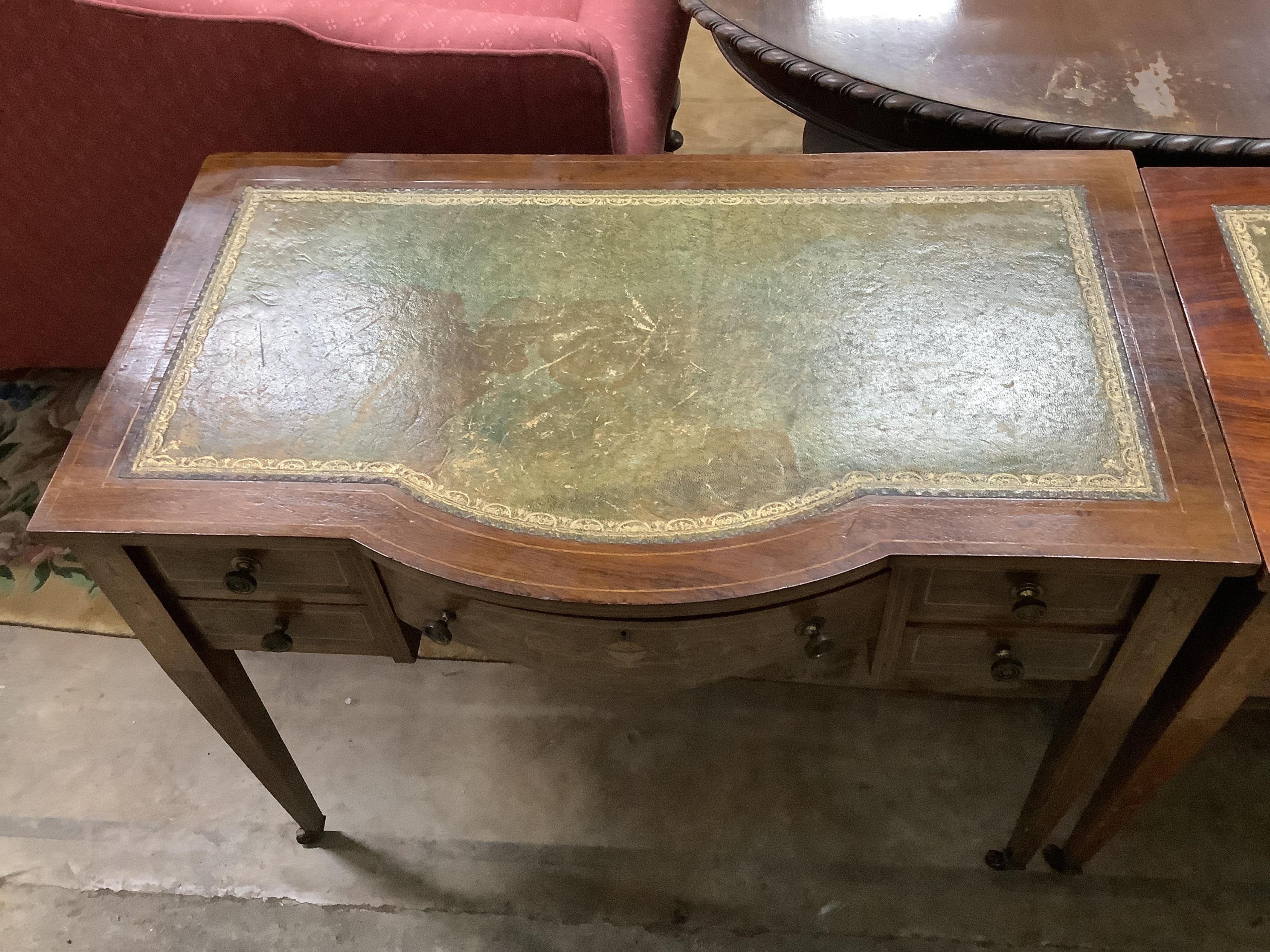 A near pair of Edwardian mahogany kneehole writing tables, larger width 91cm, depth 52cm, height 72cm. Condition - fair